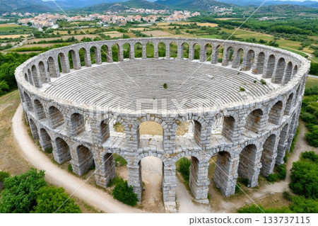 Massive ancient stone amphitheater with double arches aerial view Massive ancient stone amphitheater with double arches aerial view 133737115