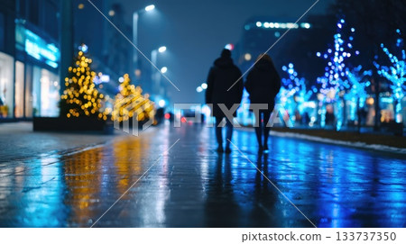 Silhouetted couple walking through illuminated city street with Christmas trees 133737350