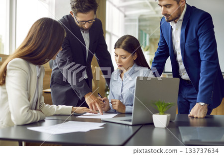 Group of business people having a meeting in office, signing a contract on workplace. Group of business people having a meeting in office, signing a contract on workplace. 133737634