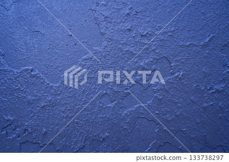 A blue iron wall texture with layers of metallic paint and fine cracks. Close-up of an abstract background with a metallic sheen for graphic design. Horizontal photo. Copy space. A blue iron wall texture with layers of metallic paint and fine cracks. Close-up of an abstract background with a metallic sheen for graphic design. Horizontal photo. Copy space. 133738297