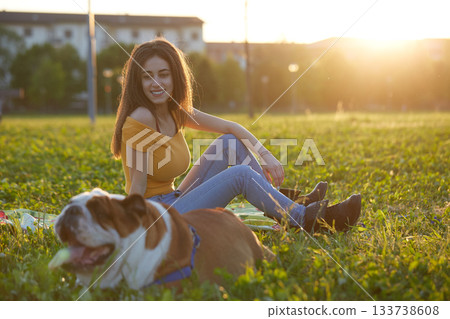 Young brunette girl play with her british bulldog 133738608