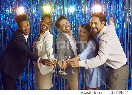 People clinking glasses of champagne on shiny curtain background People clinking glasses of champagne on shiny curtain background 133739645