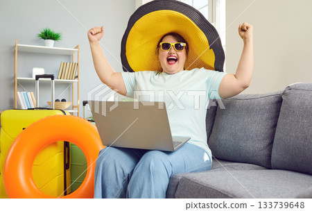 Happy excited overweight woman bought tickets at bargain price Happy excited overweight woman bought tickets at bargain price 133739648
