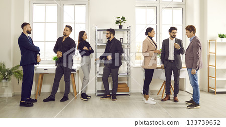 Business colleagues communicating during staff meeting in office 133739652