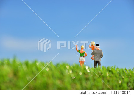 Image of a family waving under the blue sky Image of a family waving under the blue sky 133740015