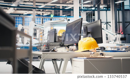 Computer software in photovoltaics factory used for optimizing production flow. PC program in empty sustainable energy solar panels plant used for monitoring manufacturing process. Computer software in photovoltaics factory used for optimizing production flow. PC program in empty sustainable energy solar panels plant used for monitoring manufacturing process. 133740537