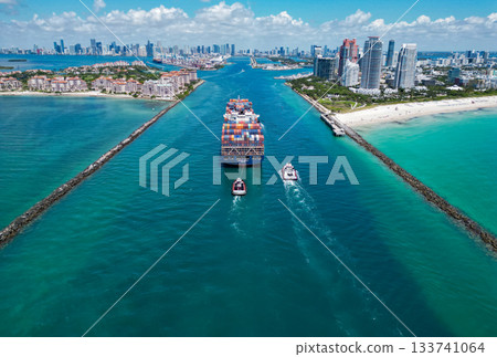 Miami, Florida, USA - June 06, 2024: Miami marina bay view. Cargo ship in Florida. Miami beach with barge. Cargo ship barge in Miami Biscayne bay. Large Container Ship Entering Harbor and City Miami, Florida, USA - June 06, 2024: Miami marina bay view. Cargo ship in Florida. Miami beach with barge. Cargo ship barge in Miami Biscayne bay. Large Container Ship Entering Harbor and City 133741064