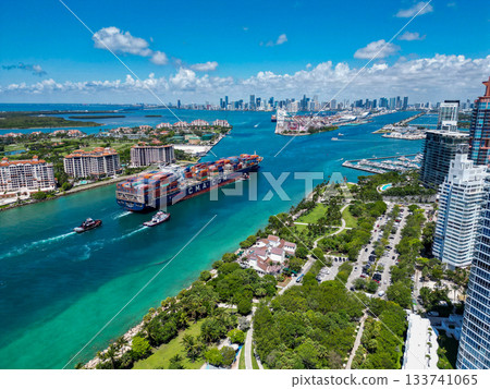 Miami, Florida, USA - June 06, 2024: Miami beach with barge in Biscayne bay. Cargo ship barge in Miami Biscayne bay. Miami marina bay view. Cargo ship in Florida. Commercial vessel Miami, Florida, USA - June 06, 2024: Miami beach with barge in Biscayne bay. Cargo ship barge in Miami Biscayne bay. Miami marina bay view. Cargo ship in Florida. Commercial vessel 133741065