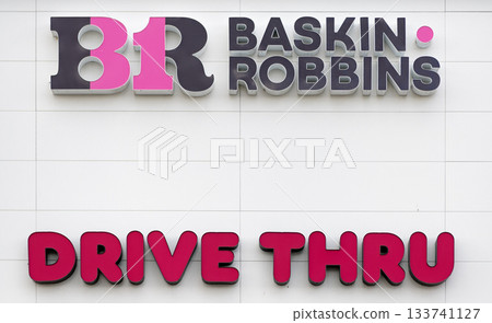 Chicago, USA - August 16, 2024: Baskin Robbins brand retail shop logo sign. Drive thru. 133741127