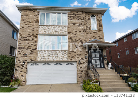 Architecture concept. Home in suburb. Residential house. Suburban home in neighborhood. Private residential architecture dwelling. Suburban house architecture. Cozy suburban house. Private life Architecture concept. Home in suburb. Residential house. Suburban home in neighborhood. Private residential architecture dwelling. Suburban house architecture. Cozy suburban house. Private life 133741128