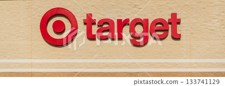 Chicago, USA - August 16, 2024: Target Corporation corporate logo on retail department store. Target retail store sign logo Chicago, USA - August 16, 2024: Target Corporation corporate logo on retail department store. Target retail store sign logo 133741129