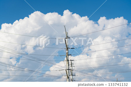 High voltage. Electricity power pylon. Electricity tower. Electrical energy. Power transmission tower. Energy consumption. Electricity power lines and sky. Green energy. Electric voltage station 133741132