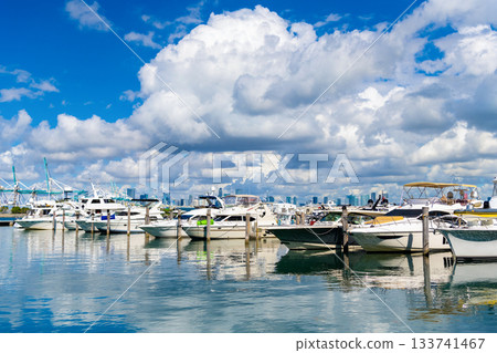 Private luxury boat anchored off Miami beach for summer vacation in marina bay South beach, Florida Private luxury boat anchored off Miami beach for summer vacation in marina bay South beach, Florida 133741467