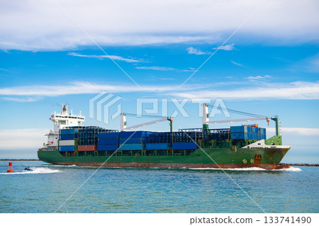 Container on barge at Port Miami. Cargo ship barge at harbor with container. Cargo ship barge in Miami Biscayne bay. Miami beach with barge in Biscayne bay. Cargo ship with container in Miami Container on barge at Port Miami. Cargo ship barge at harbor with container. Cargo ship barge in Miami Biscayne bay. Miami beach with barge in Biscayne bay. Cargo ship with container in Miami 133741490