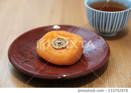 Dried persimmon and roasted green tea Dried persimmon and roasted green tea 133742979