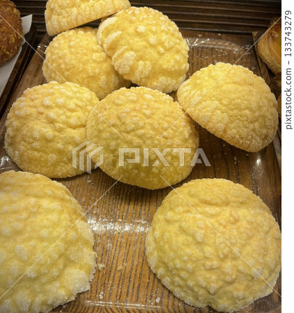 Melon Ppang, a fluffy Korean bread shaped like a melon with a crisp, sugary top layer. Popular for its sweet flavor and unique look, it's a delightful treat perfect for snacks or desserts. Melon Ppang, a fluffy Korean bread shaped like a melon with a crisp, sugary top layer. Popular for its sweet flavor and unique look, it's a delightful treat perfect for snacks or desserts. 133743279