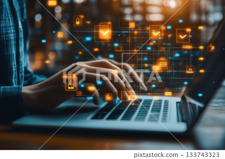 Hands Scanning Biometric Fingerprint Data on Laptop Screen 133743323