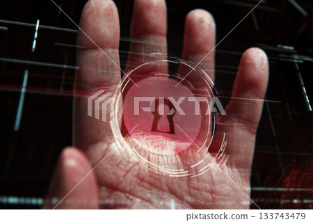 A hand is shown with a red circle with a keyhole in it. Concept of mystery and intrigue 133743479