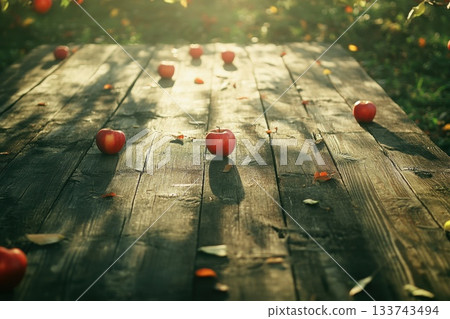 Rustic Wooden Table with Fresh Juicy Apples Scattered on Surface Rustic Wooden Table with Fresh Juicy Apples Scattered on Surface 133743494