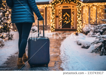 Cozy Holiday Homecoming with Luggage in Winter Wonderland Setting Cozy Holiday Homecoming with Luggage in Winter Wonderland Setting 133743917