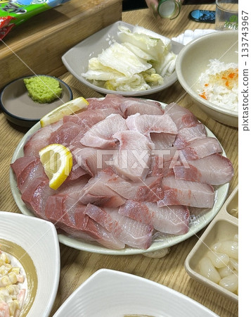 Fresh and buttery yellowtail sashimi (bangeo) with a rich, melt-in-your-mouth texture, offering a perfect balance of clean flavors and delicate sweetness in every luxurious bite. Fresh and buttery yellowtail sashimi (bangeo) with a rich, melt-in-your-mouth texture, offering a perfect balance of clean flavors and delicate sweetness in every luxurious bite. 133743967
