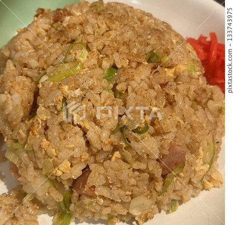 nasi goreng or fried rice traditional frying rice dish from indonesia made of Precooked rice fried in a small amount of oil, then spiced up with shallots, garlic, chili and sweet soy sauce. nasi goreng or fried rice traditional frying rice dish from indonesia made of Precooked rice fried in a small amount of oil, then spiced up with shallots, garlic, chili and sweet soy sauce. 133743975