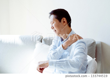 Senior man suffering from stiff neck 133744519