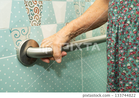 Asian elderly woman patient use toilet bathroom handle security in nursing hospital, healthy strong medical. Asian elderly woman patient use toilet bathroom handle security in nursing hospital, healthy strong medical. 133744822