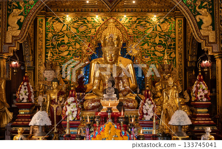 Beautiful Buddha images situated in Viharn of Wat Ming Muang an iconic temple in traditional Lanna style located in the centre of Chiang Rai town, Thailand. 133745041