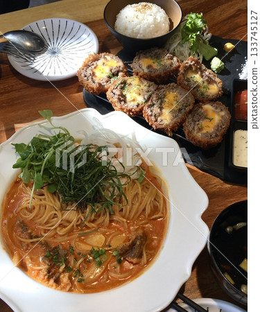 Classic spaghetti coated in rich tomato sauce, offering a simple yet delicious combination of tangy, savory flavors perfect for a comforting meal. 133745127