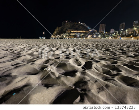 nighttime sand with shadows, closeup of textured sand with deep ripples and shadows at night nighttime sand with shadows, closeup of textured sand with deep ripples and shadows at night 133745223