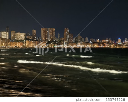 night reflections on urban waters, city lights reflect on restless water surfaces at night night reflections on urban waters, city lights reflect on restless water surfaces at night 133745226