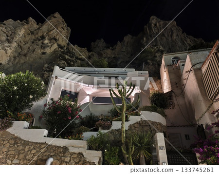 intimate boutique guesthouse ambiance, whimsical guesthouse nestled under rocks with lanternlit intimate boutique guesthouse ambiance, whimsical guesthouse nestled under rocks with lanternlit 133745261