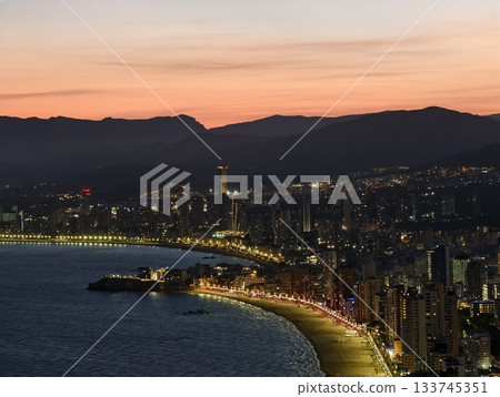 sunset coastal walk, golden hour seaside promenade illuminated with gentle waves and vibrant sunset coastal walk, golden hour seaside promenade illuminated with gentle waves and vibrant 133745351