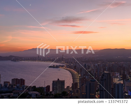 crescent moon over tranquil coast, serene seaside sunset illuminated by crescent moon and pastel crescent moon over tranquil coast, serene seaside sunset illuminated by crescent moon and pastel 133745372