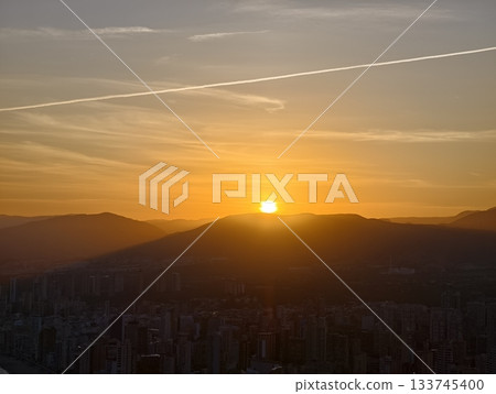 morning reveals serenity, calm of morning presents scene where dawn unveils both mountain and city 133745400