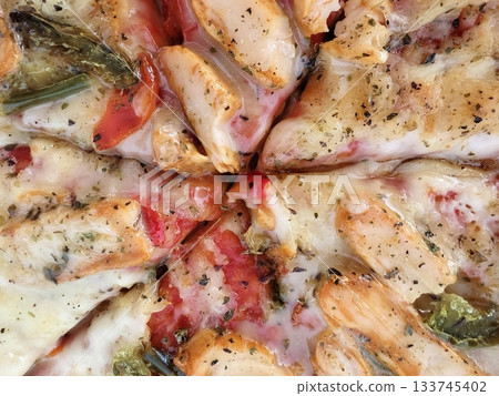 closeup of chicken pizza with fresh herbs, delicious chicken pizza slices with herbs and melted closeup of chicken pizza with fresh herbs, delicious chicken pizza slices with herbs and melted 133745402