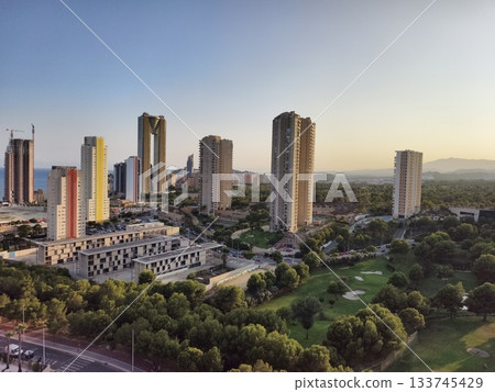 peaceful city park with towers at sunset, tranquil community scene with green spaces and urban peaceful city park with towers at sunset, tranquil community scene with green spaces and urban 133745429