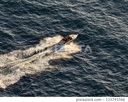 speedboat cruises sunlit waters, thrilling speedboat ride illuminating sunny coastal scenery speedboat cruises sunlit waters, thrilling speedboat ride illuminating sunny coastal scenery 133745566