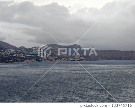 serene seascape with distant island, minimalist ocean view showcasing soft horizons and textures 133745716