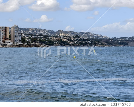 seaside urban scene, coastal cityscape with waves, highrise buildings over choppy seascape and hills seaside urban scene, coastal cityscape with waves, highrise buildings over choppy seascape and hills 133745763