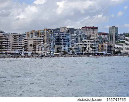 highrise coastal urban scene, vibrant beachfront city with towering apartments and busy hotels highrise coastal urban scene, vibrant beachfront city with towering apartments and busy hotels 133745765