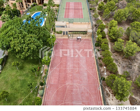 sports park scene, outdoor court with amenities, vibrant outdoor sports area surrounded by trees 133745884