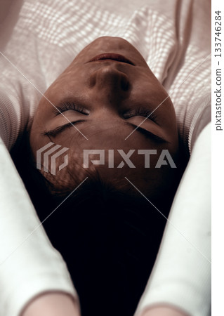 Portrait of beautiful girl with closed eyes. Sensual woman with shadows on her face. Concept of sunbathing, relaxation. High quality photo Portrait of beautiful girl with closed eyes. Sensual woman with shadows on her face. Concept of sunbathing, relaxation. High quality photo 133746284