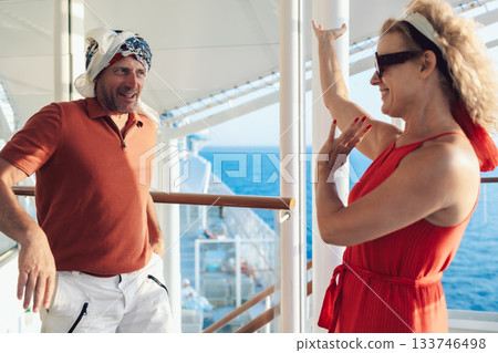 Couple in love on cruise ship. Man and woman in love enjoying their romantic vacation. Cheerful people dancing oriental dances. High quality photo Couple in love on cruise ship. Man and woman in love enjoying their romantic vacation. Cheerful people dancing oriental dances. High quality photo 133746498