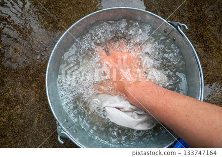 Hand wash your work clothes 133747164