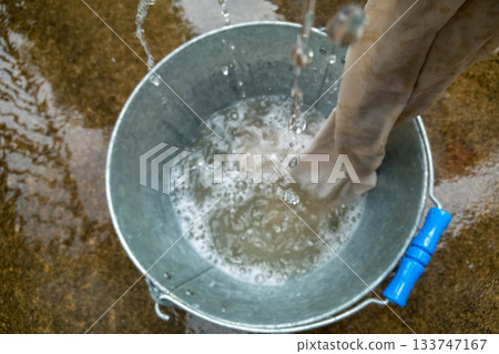 Washing dirty work clothes after rice planting Washing dirty work clothes after rice planting 133747167