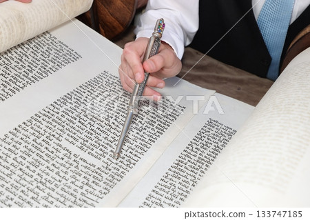 Hand of boy reading the Jewish Torah at Bar Mitzvah 133747185