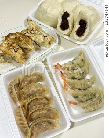 Korean dumplings filled with a mix of savory ingredients like ground meat, tofu, and vegetables. Mandu can be steamed, boiled, or pan-fried, making it a versatile and delicious snack or meal. Korean dumplings filled with a mix of savory ingredients like ground meat, tofu, and vegetables. Mandu can be steamed, boiled, or pan-fried, making it a versatile and delicious snack or meal. 133747644