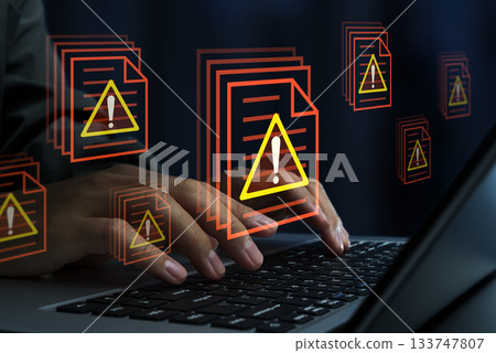 Data leak or information leakage due to insider threat or unauthorized access. Confidential files and warning triangle icon. Laptop 133747807